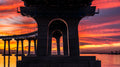 Fiery sunrise beneath the Coronado Bridge at Tidelands Park, reflecting across San Diego Bay
