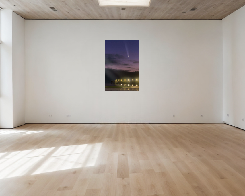 Empty room with wooden floor, white walls, and a large window.