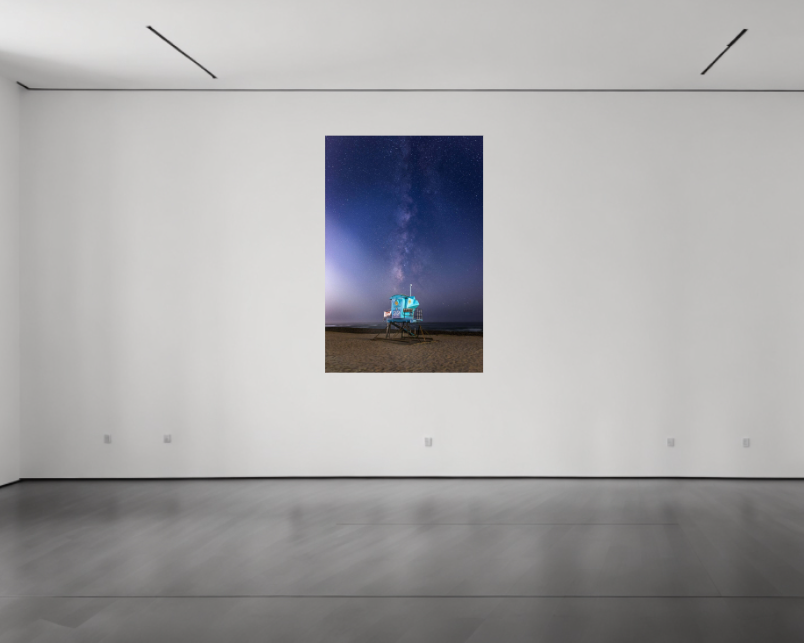 Modern art gallery with a large abstract painting on a white wall.